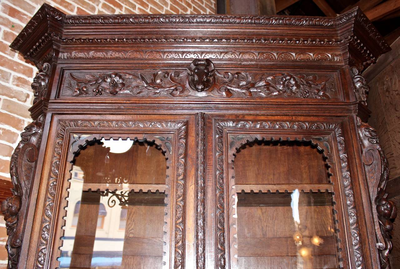 This French bookcase is made in the ornately carved 
