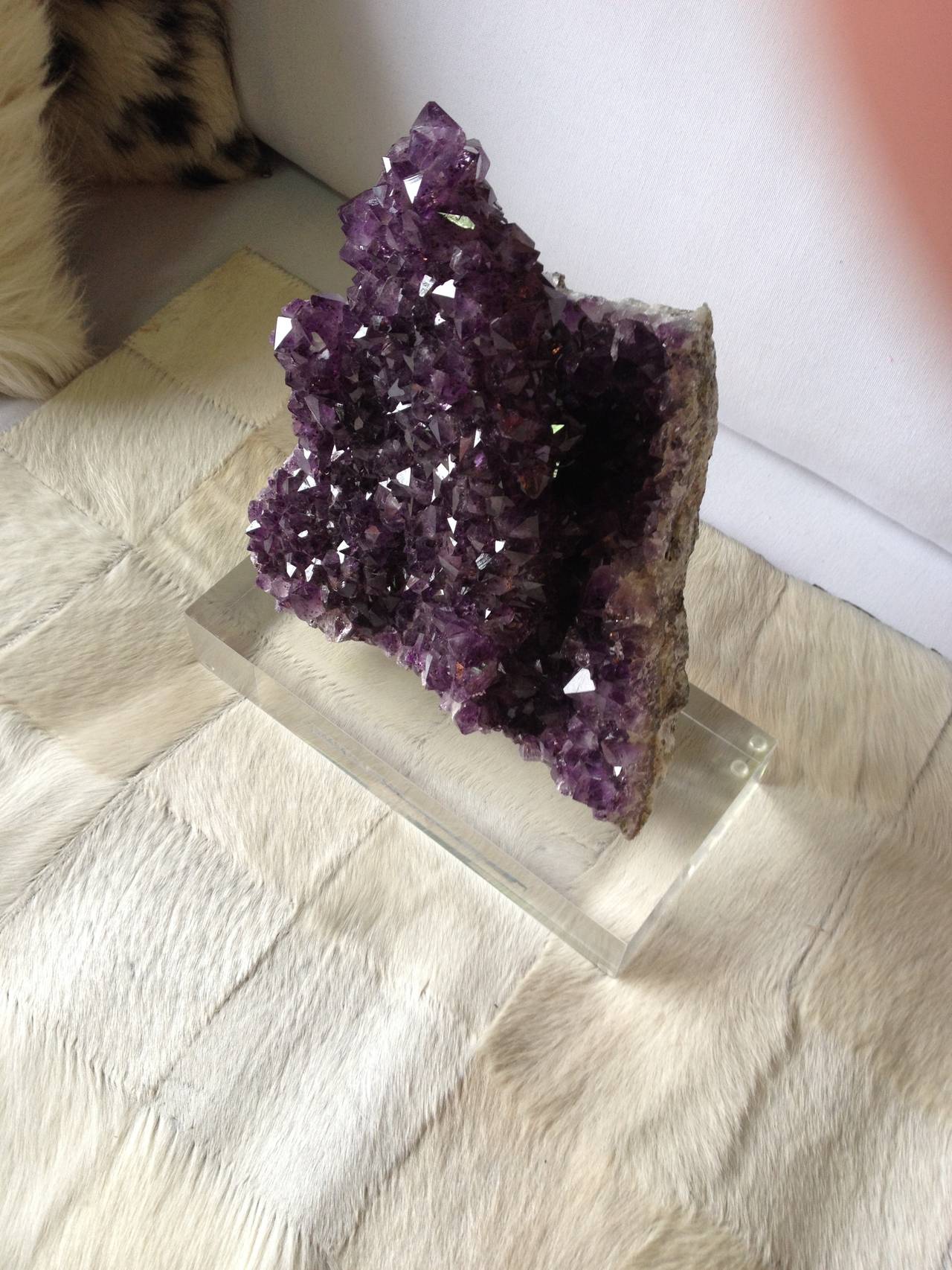 Large natural amethyst stone mounted on Lucite base.