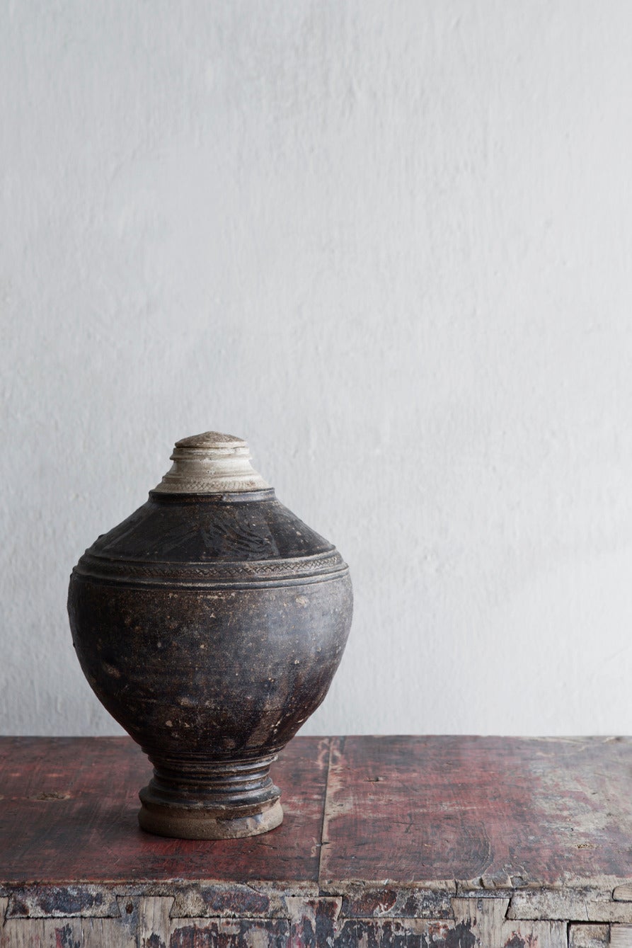 Antique Cambodian Khmer jar with lid. The jar has a beautiful patina.
