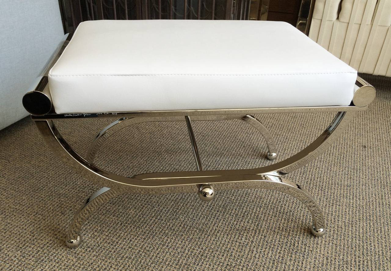 We have three benches ready to ship, two in brass and one in nickel.

Exceptional pair of Empire style benches designed and manufactured by Charles Hollis Jones.
The benches were designed in the 1960s and they are just as influential
