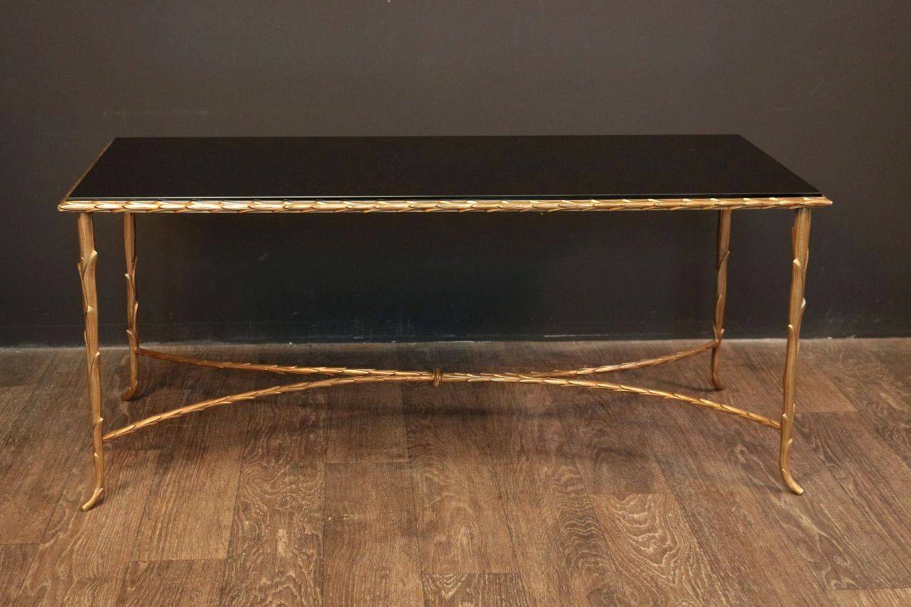 Coffee table by Maison Bagues. Corn carved bronze structure and feet. A crossbar between the feet in carved bronze. Black opalin glass top. The top has been changed. Perfect condition. Circa 1950s-1960s.