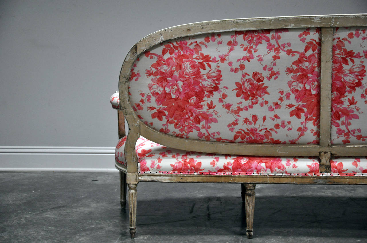 Painted, early 19th c. Louis XVI style settee upholstered in Bennison fabric. In Good Condition In Houston, TX