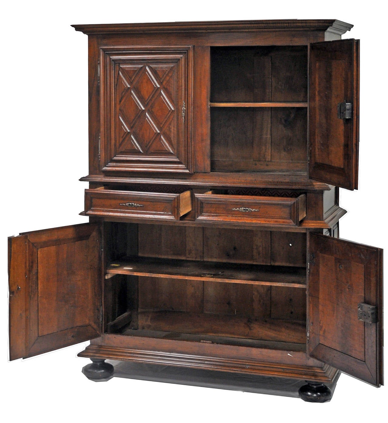 Beautiful cabinet with raised diamond motif on doors and bun feet. 

Established in 1979, Joyce Horn Antiques, ltd. continues its 36 year tradition of being a family owned and operated business specializing in hand procured, Fine European antique