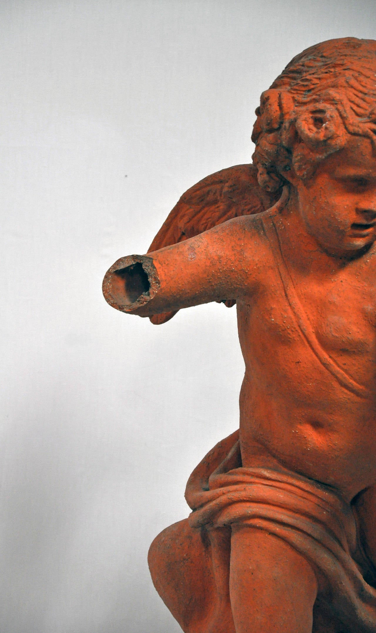 French Mid-19th Century Terra Cotta Garden Statue of Cupid For Sale