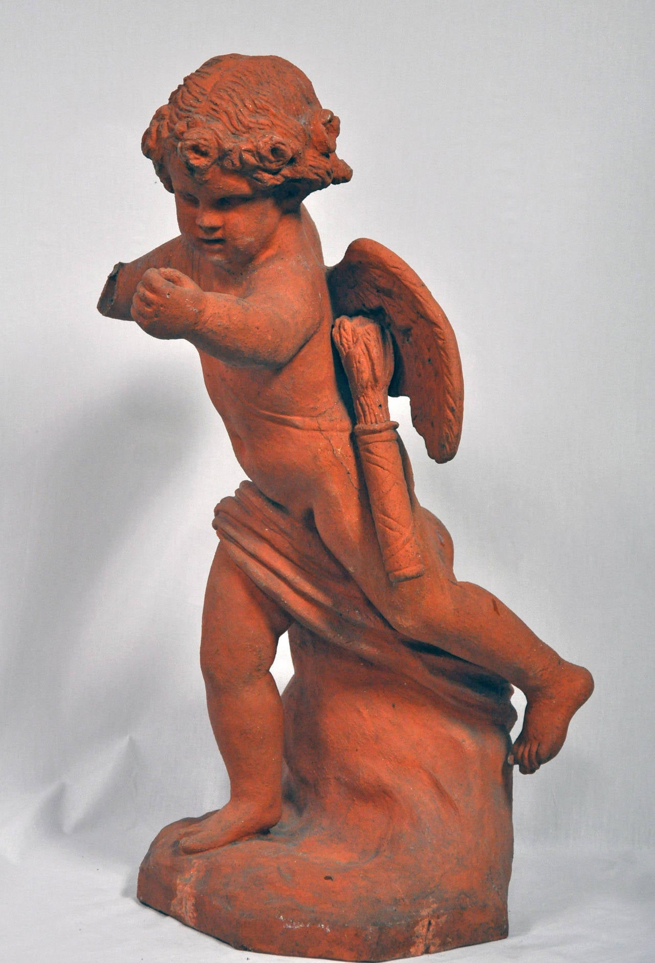 Terracotta Mid-19th Century Terra Cotta Garden Statue of Cupid For Sale