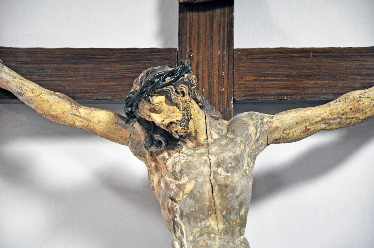Beautifully articulated Christ figure on original cross with tole plaque, 18th century Germany; polychromed wood.

Established in 1979, Joyce Horn Antiques, ltd. continues its 36 year tradition of being a family owned and operated business