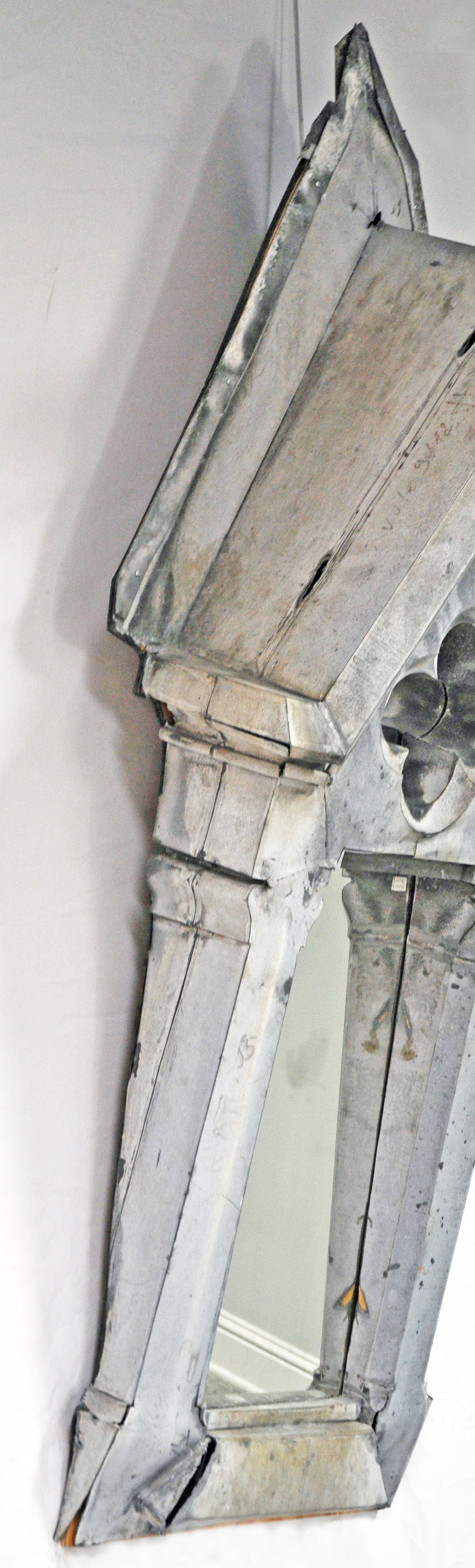 Architectural remnant in zinc with quatrefoil cut-out motif. Mirror added and mounted to wood for stability. Large-scale would make a unique addition to a powder bath, entry or used as a piece of art. 

Established in 1979, Joyce Horn Antiques,