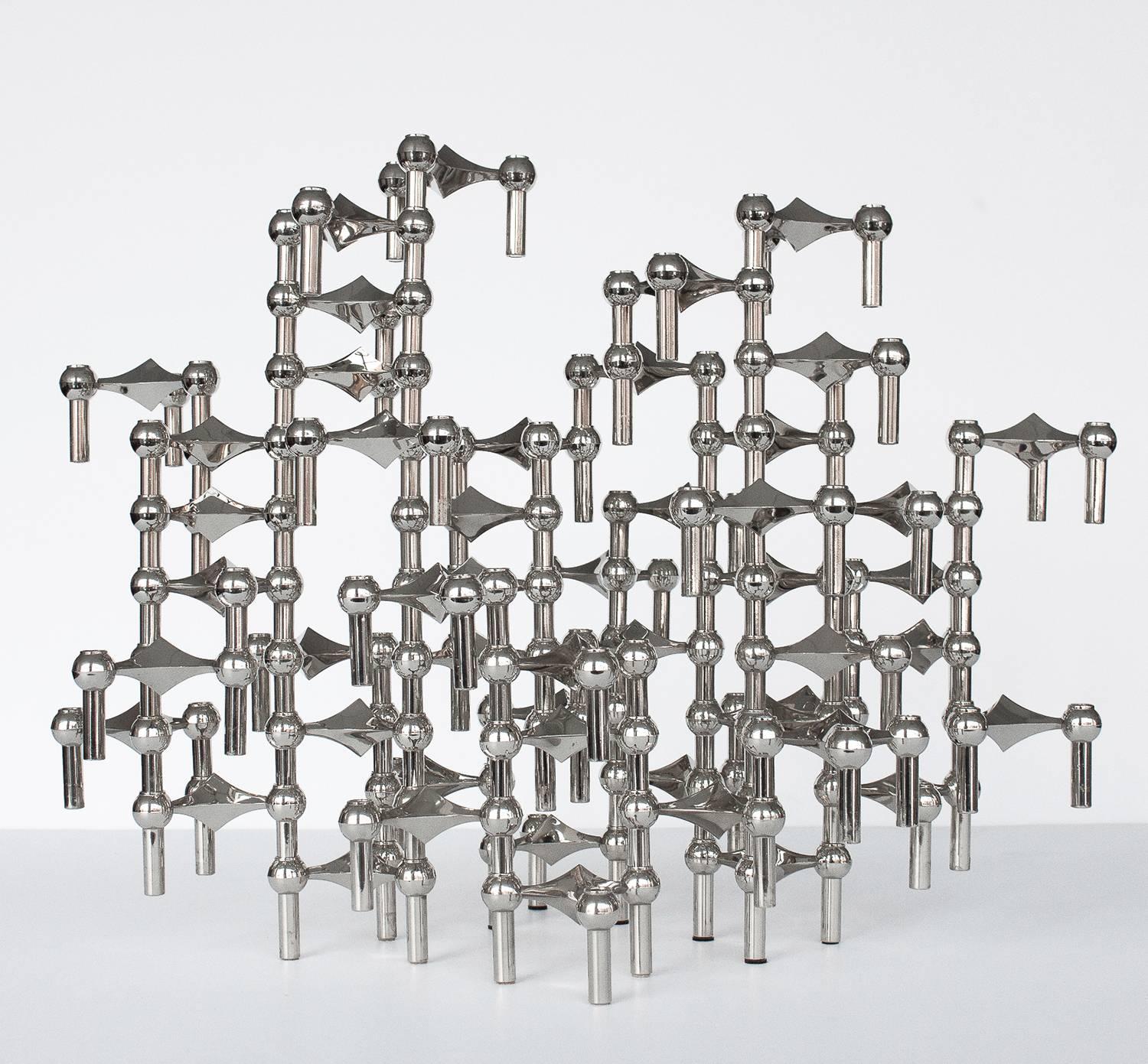 A sculpture made of 56 individual candleholders by Caesar Stoffi and Fritz Nagel for BMF, Germany. This modular design can be configured in an endless number of ways both vertically and horizontally by stacking each interlocking piece. Perfect as a