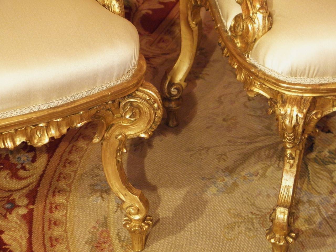 Pair of unique and wonderfully carved armchairs, all in giltwood,
the armrest has an incredible shape, carved scrolls on armrest and feet, the upholstery is new, period middle of 18th century, Italian.
Probably from Genoa, the seat height is 43