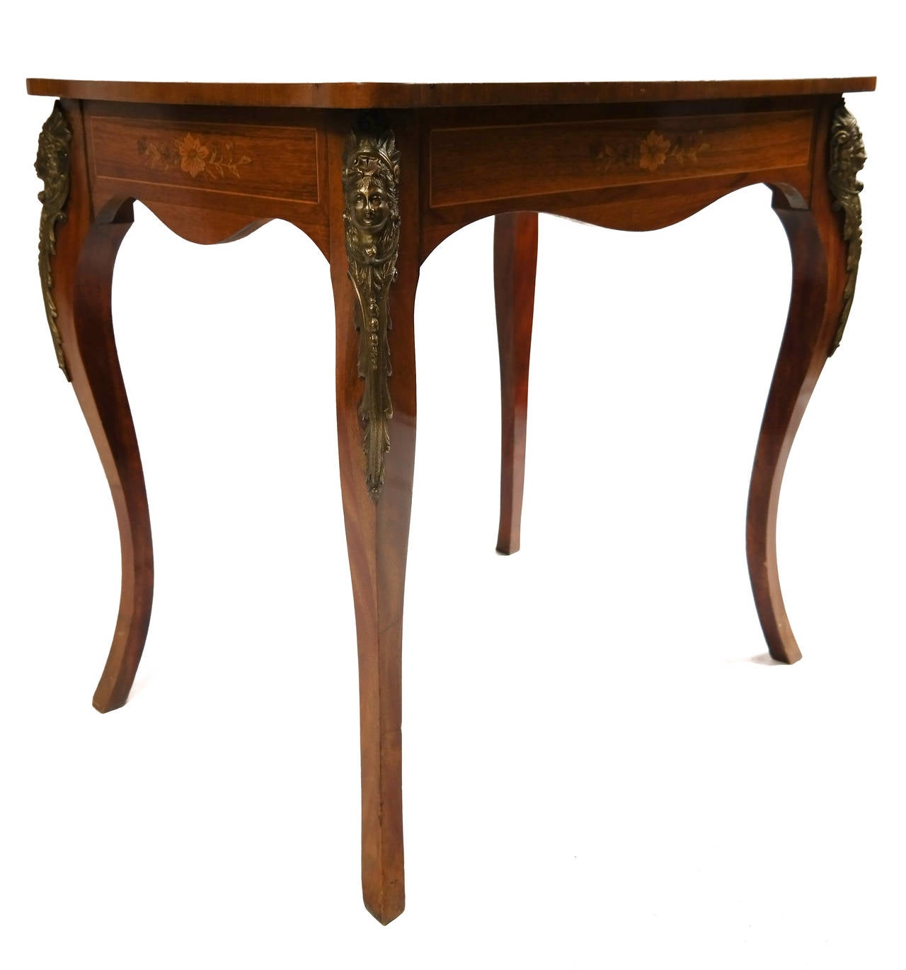 Rosewood and satinwood writing table, the quartered top with central floral marquetry outlined by twin geometric crossbanding enhanced with ebony and satin stringing, on simple cabriole legs with mounted bronze ormolu, with satinwood stringing with