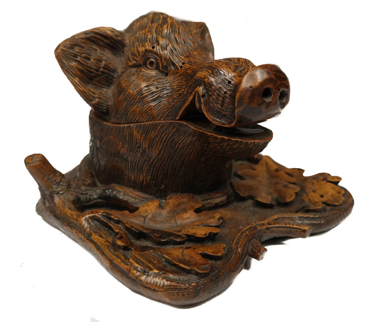 Black forest boar's head inkwell and pen rest, 18th c., linden wood