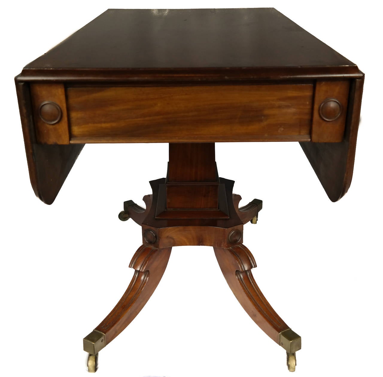Pembroke table with brass casters, American, late 19th century.