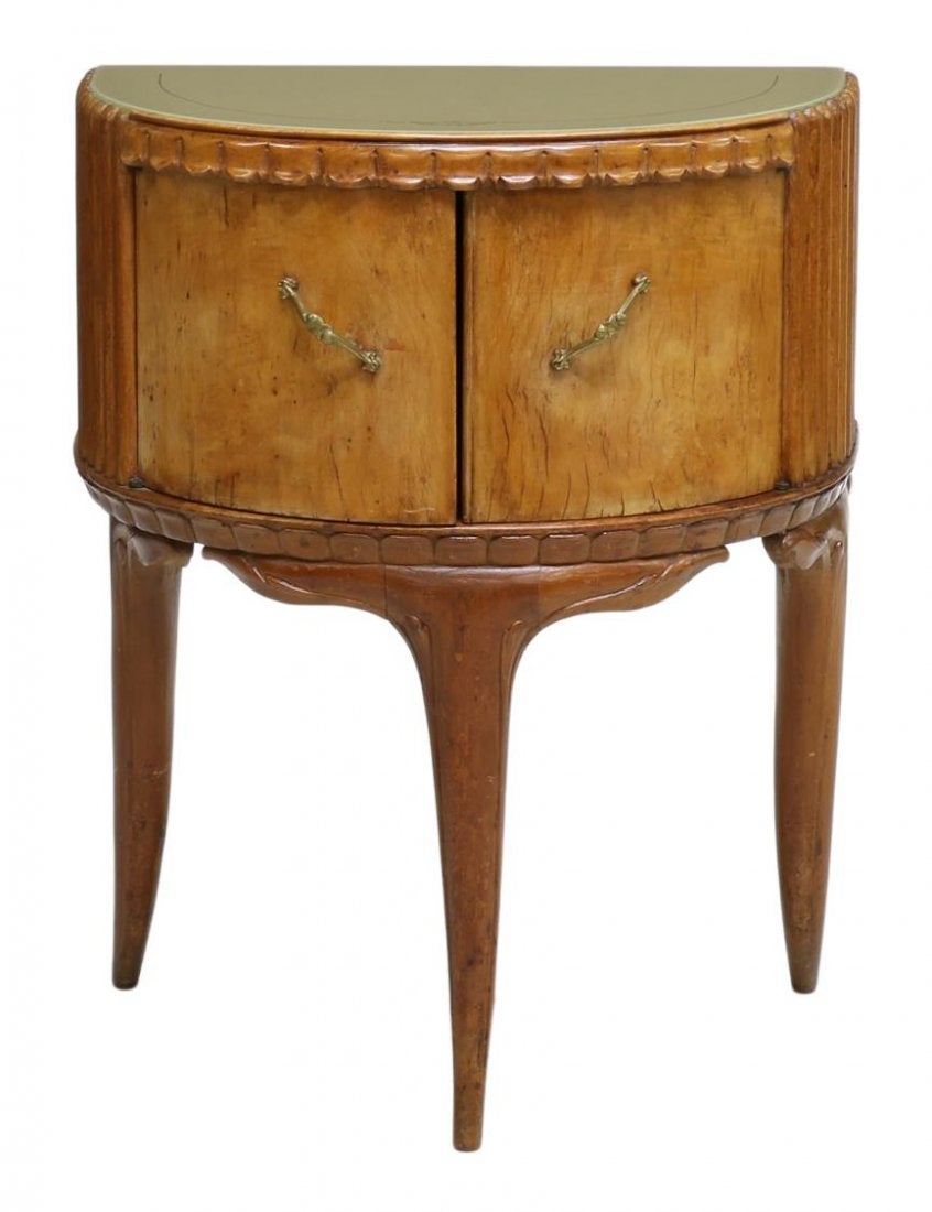 Pair of Mid-Century Modern bird's eye maple bedside cabinets, a Demilune glass top above conforming case with two doors, brass hardware, rising on three saber legs, Italian, circa 1930. Attributed to Guglielmo Ulrich.