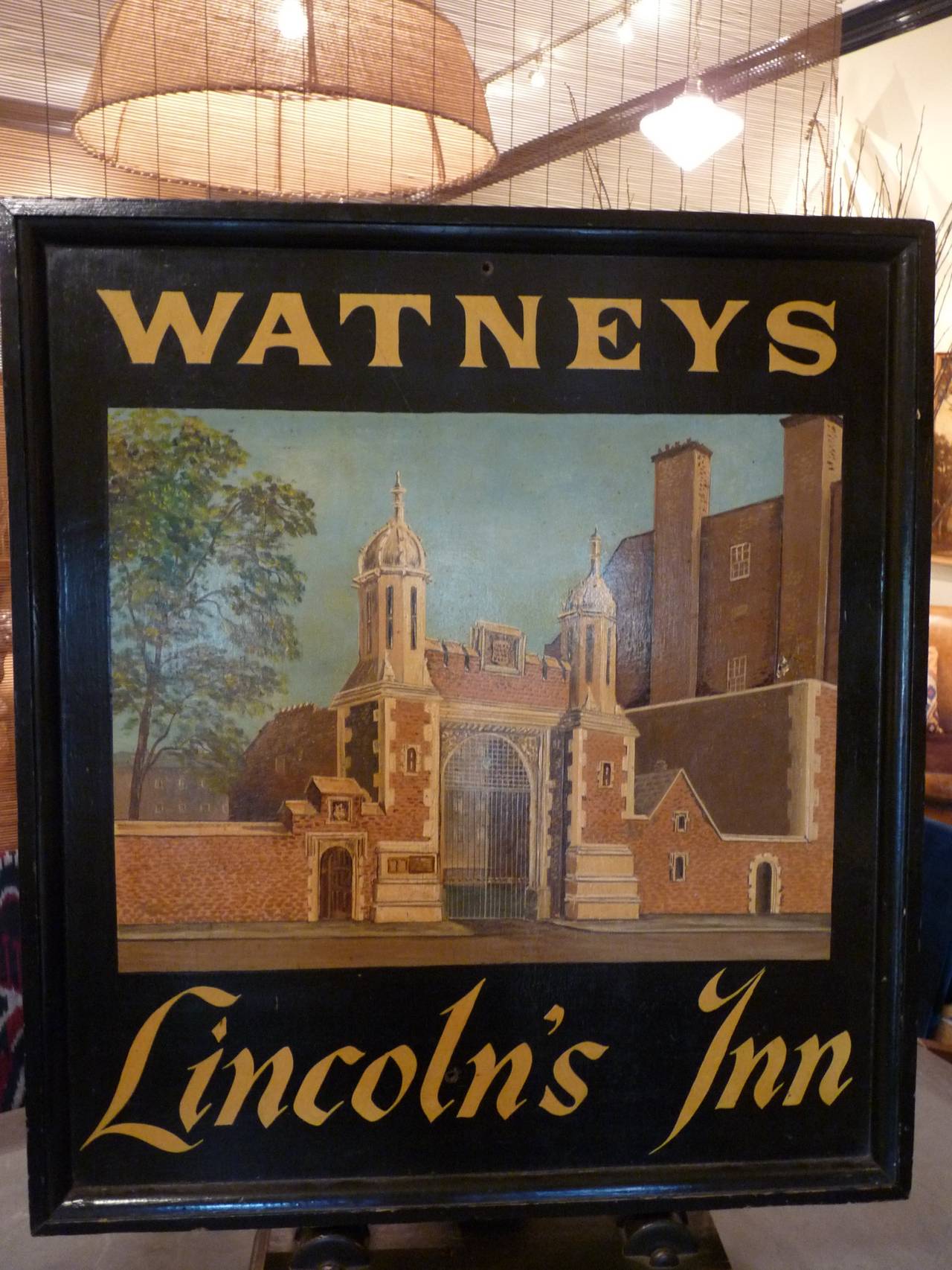 This charming English pub sign is painted on board with attractive wood frame, displaying a colorful scene.  This sign is circa 1900-1910 and is in very good condition.  Painted on one side.
