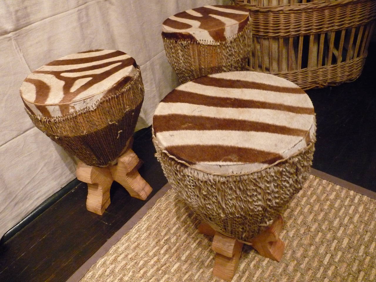 This handmade zebra hide drum comes with a custom made base to display in your home or as a side table.