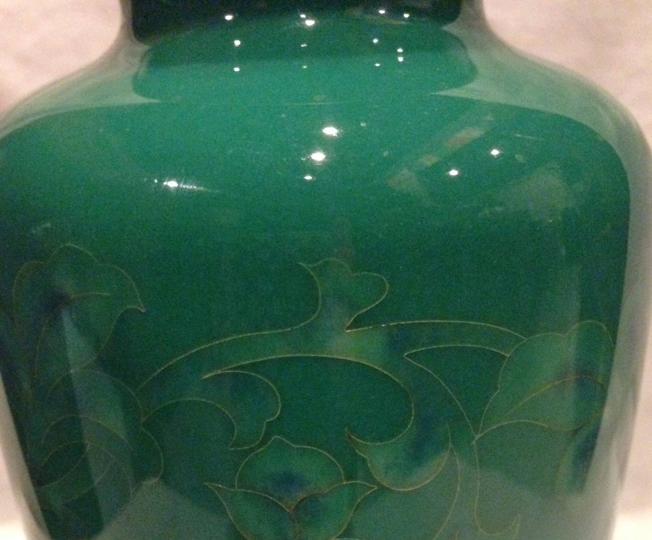 Yukio Tamura's work is often found in the Japanese royalties' imperial collections. This stunning vase features peonies in a continuous pattern. Very subtle and beautiful, the refined cloisonne work and use of celadon enamel demonstrate the artist's