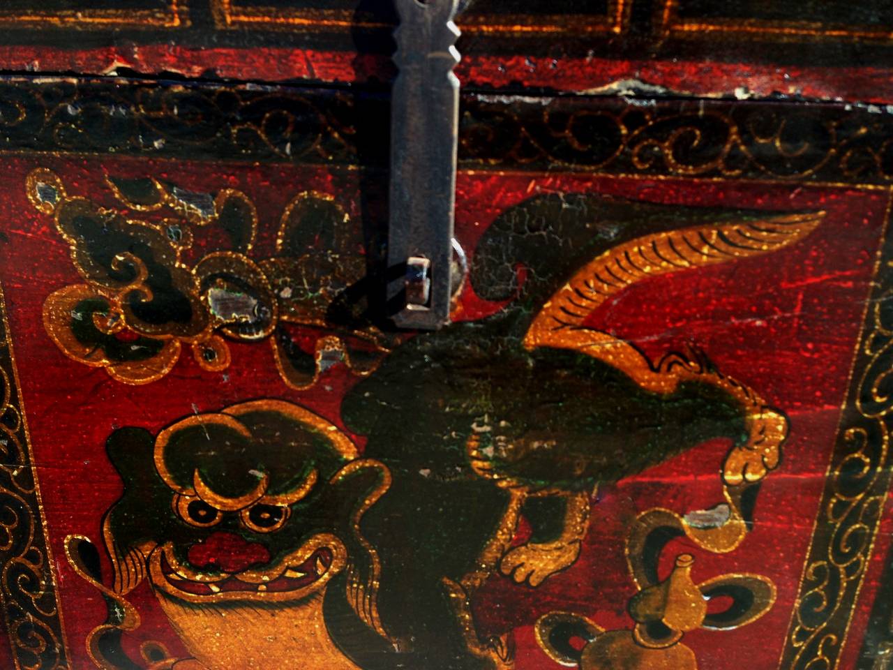 This beautiful box reflects traditional Tibetan aesthetics. It demonstrates a myriad of saturated colors such as saffron and moss green. The linear "longevity" scrolls forms the border, another typical Tibetan design. A hand painted foo