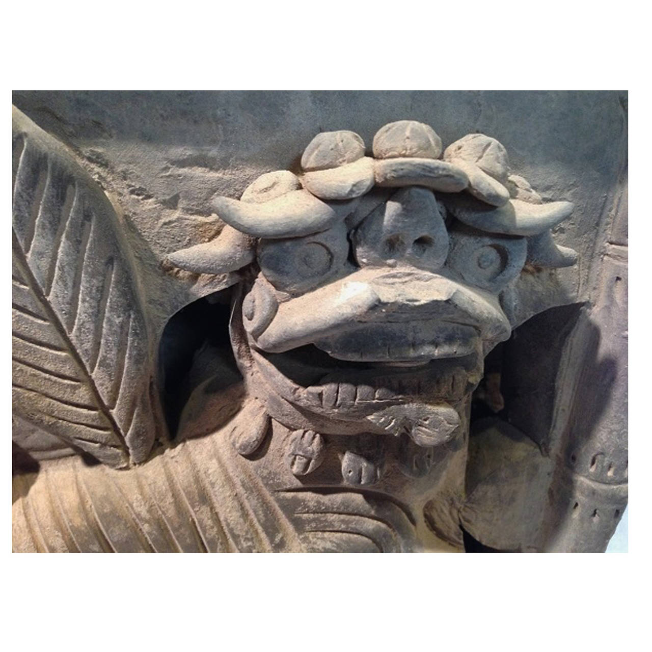 A rare,highly sought after piece for your foo dog collection. Amazing, multi-dimensional foo dog is carved from one solid piece of brick. A lively creature with a happy disposition, he is depicted with his left paw on a longevity ball with his mouth
