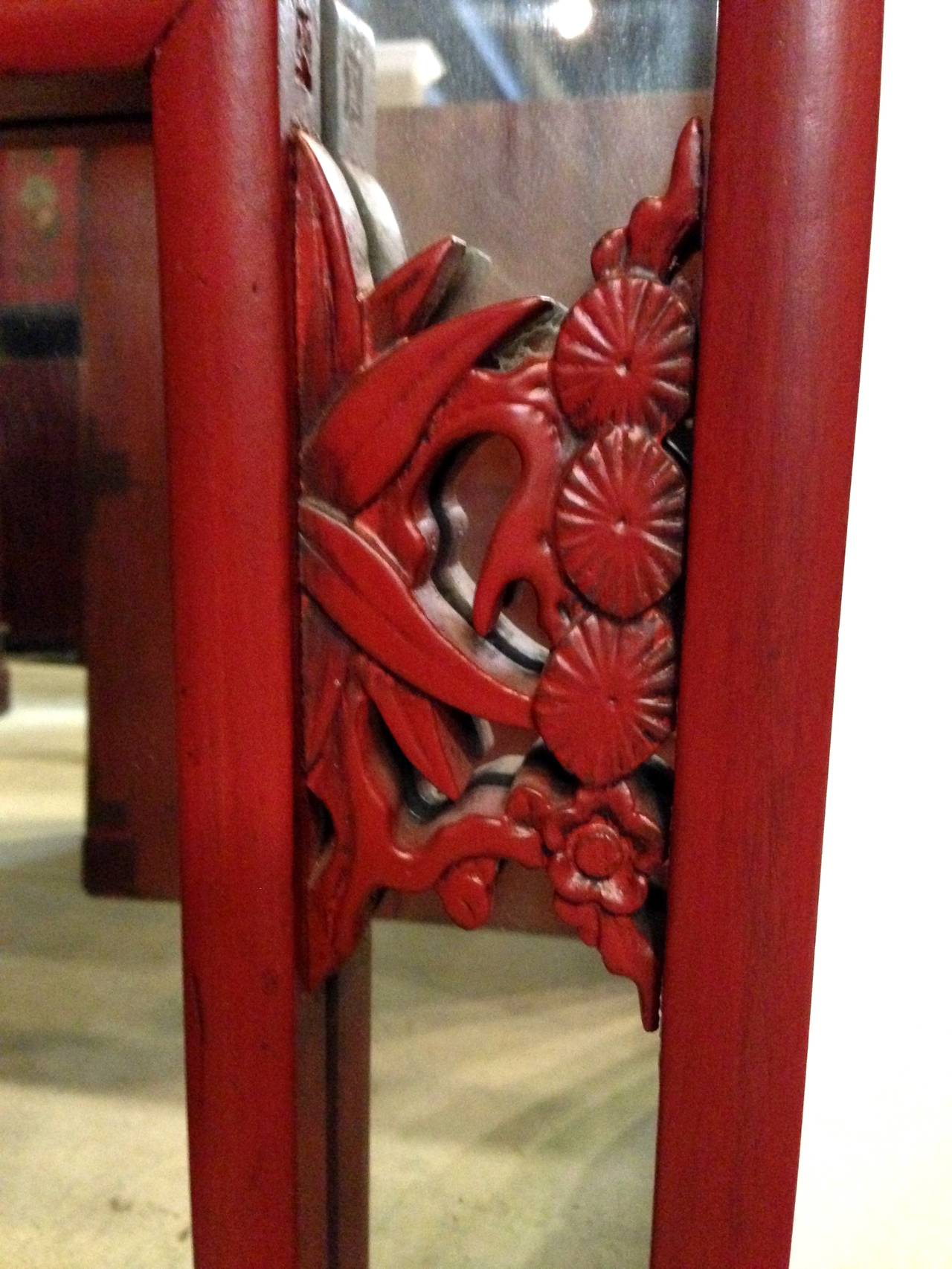 This pair of beautiful red lacquered mirrors are made with antique carved screens. Plum blossoms, pine and bamboo, known as the 