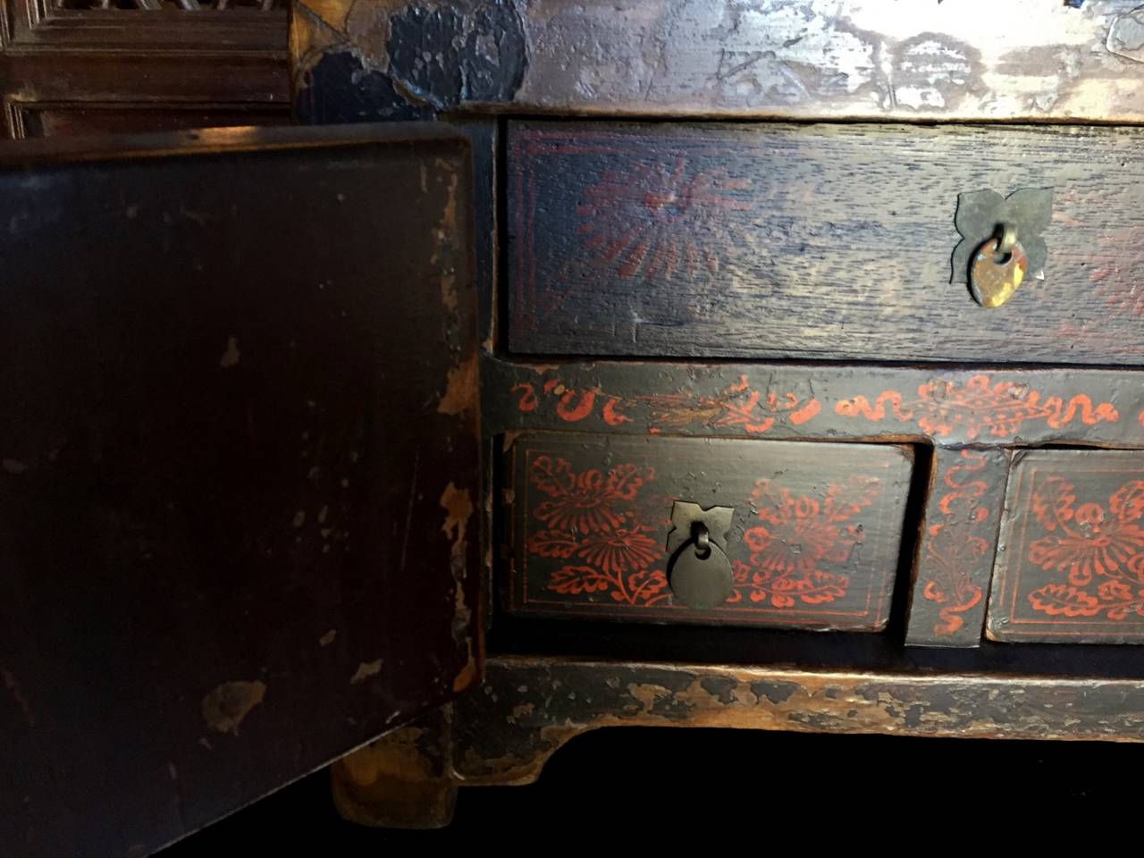 This very old chest or box has completely original painted and lacquered finish. The lacquers are multiple layered, which indicates the extensive work that was involved in its application. The doors feature a pair of vases which are symbols of peace