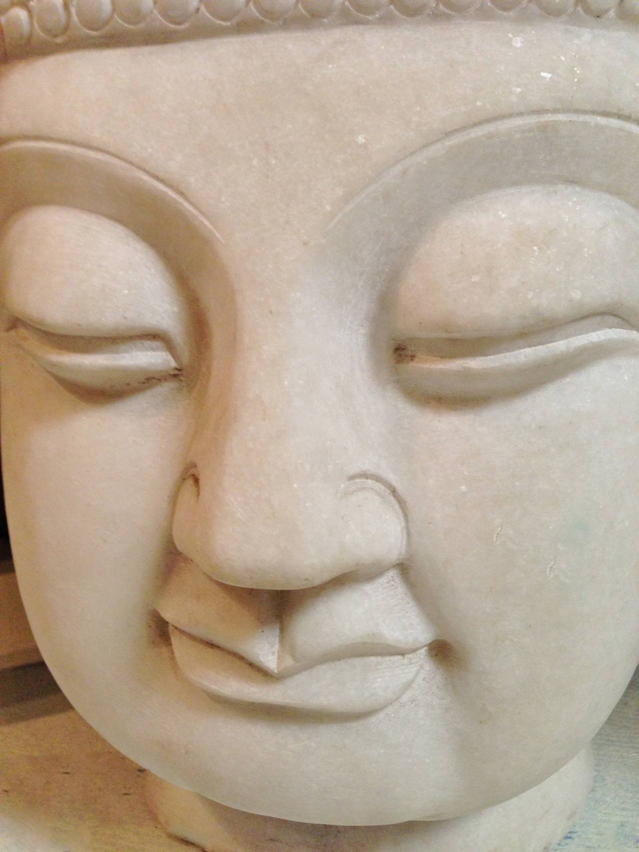 The style of this Buddha is traditional Chinese. In other words, this is the look of Buddha in most Buddhist temples in China. The expression is straightforward with little to non fussy decorations. Facial features are where the sculptor emphasizes