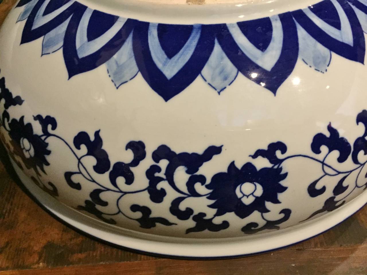 A breathtakingly beautiful blue and white sink. Hand painted depicting the flowers of peonies, this sink is a true work of art. Oversize. A timeless classic that is always in style. 

One of a kind.