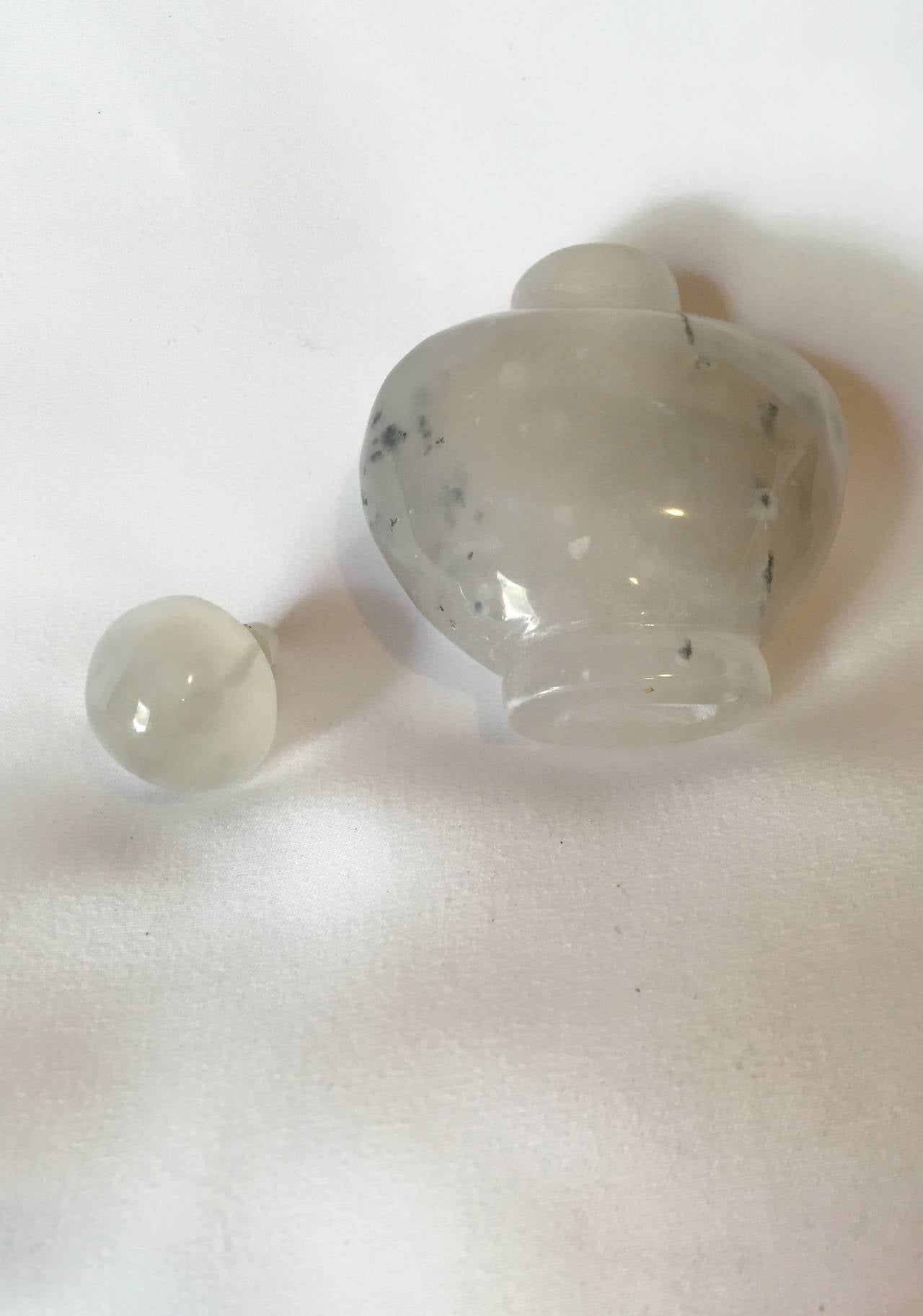 This romantic piece is carved from the most beautiful gray carnelian. The jewel stone has the rare, natural inclusions that resemble white clouds and black bamboos. The image looks like an abstract watercolor painting of swinging black bamboo in a