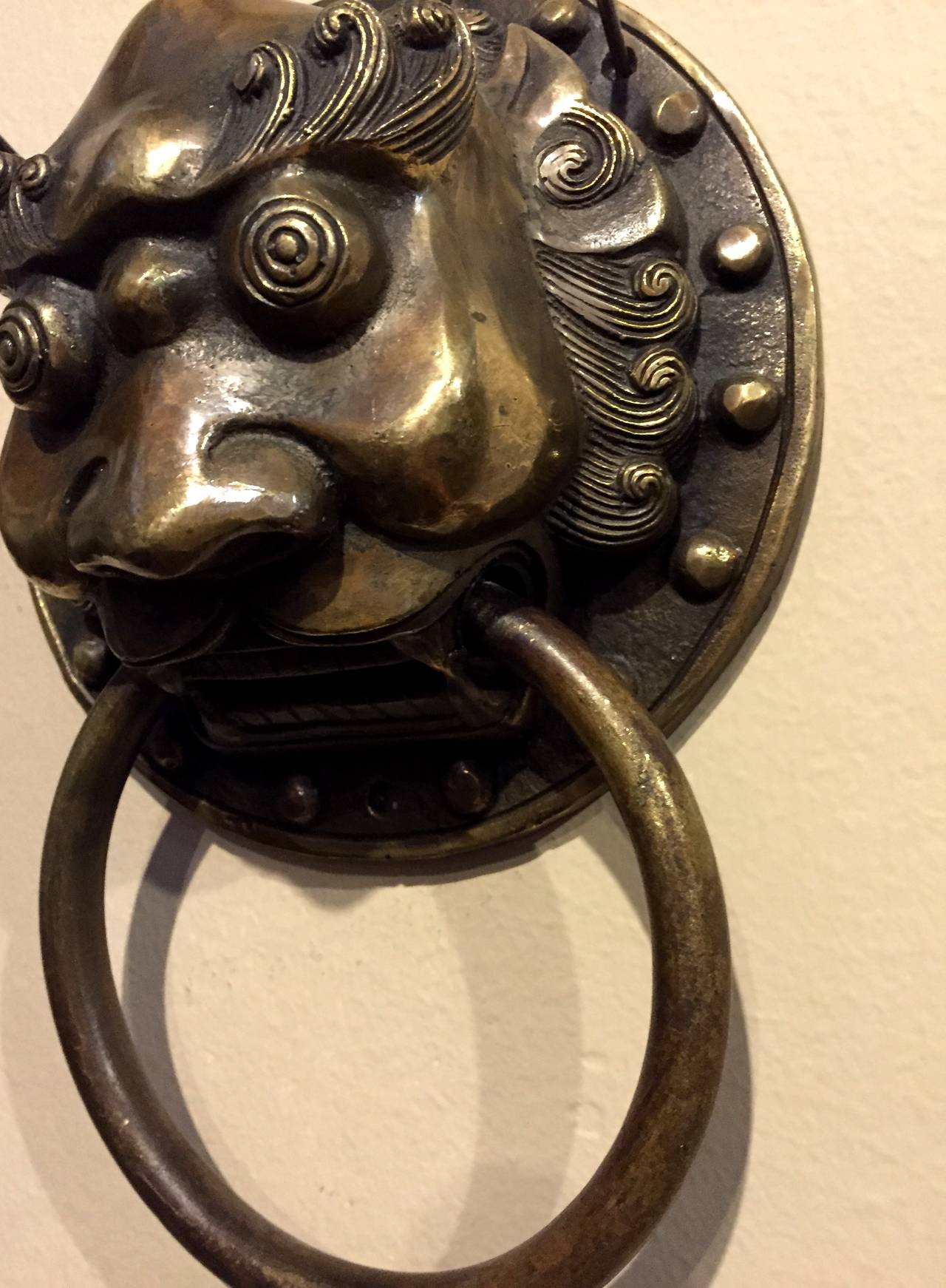 Our brass knockers can be used as door knockers or hand towel rings. Fine craftsmanship depict the ancient mythical guardians with a high level of artistic expression. 

Used singularly or in pairs, these fantastic pieces bring a sense of