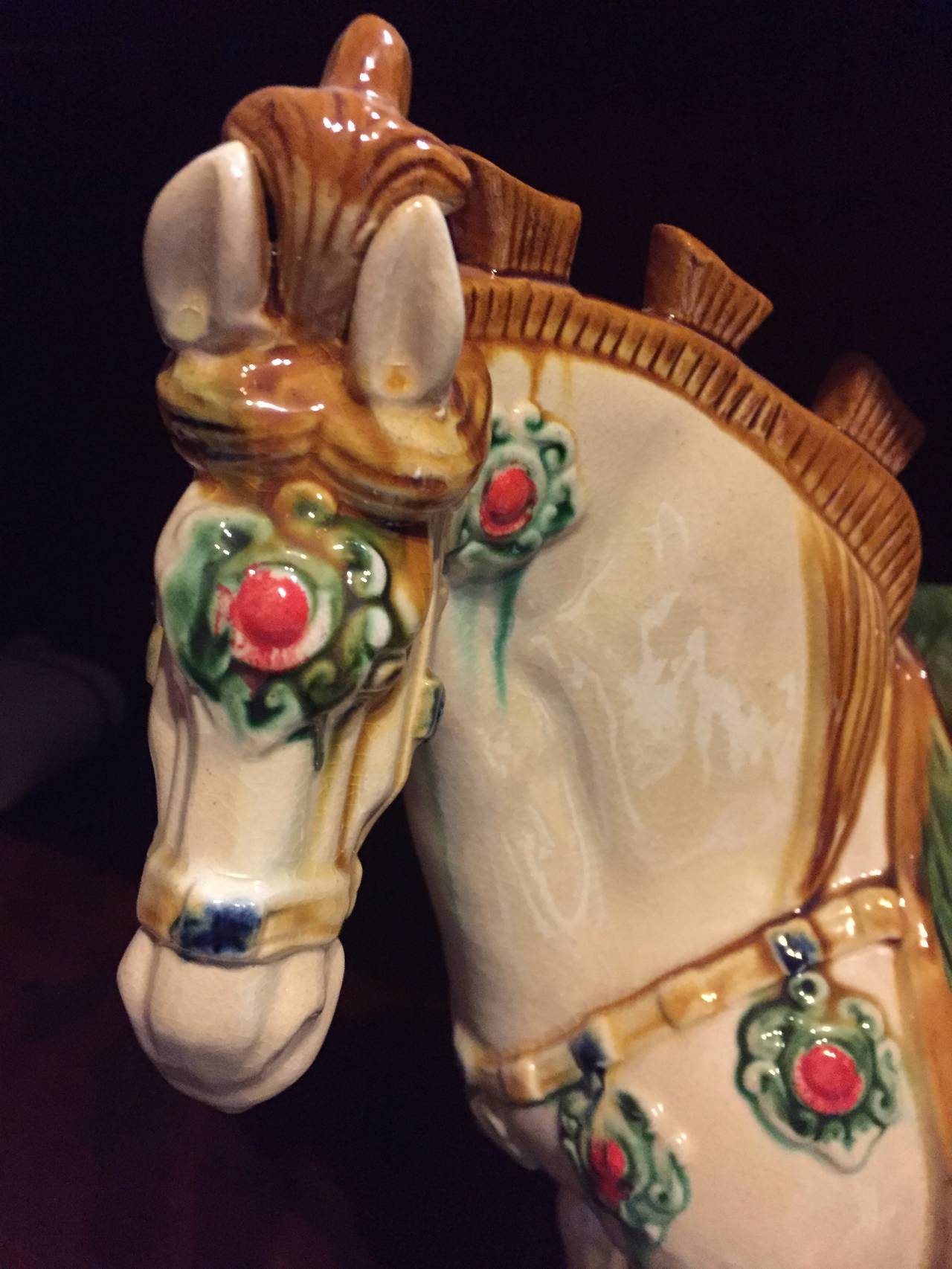 Horse in the Chinese culture symbolizes success. Our beautiful terracotta horse is hand made and painted using the ancient San Cai Tri-Glaze techniques. The splendid glossy glaze and vivid depiction of the horse make it a fantastic focal point.