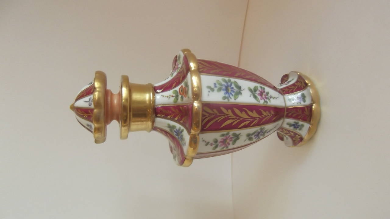 A PAIR OF Caughley Porcelain Perfume decanters, Circa 1775-1799, Caugley (English-Shropshire). 
 Beautiful burgundy, gold and all hand-painted decoration. Execllent condition, no chips or cracks.
From around 1775 to 1799, at Caughley near Broseley