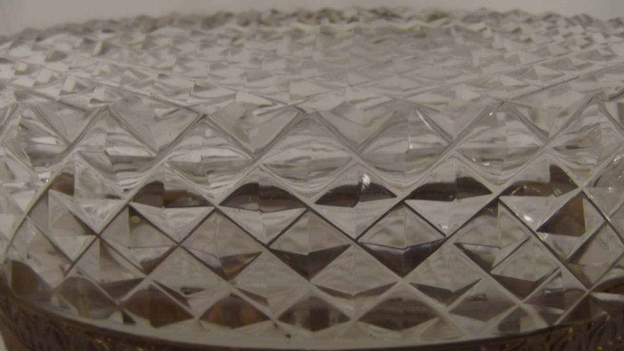 A diamond cut glass dresser box made in France 
All over diamond cutting with a starburst cut on bottom.  Attributed to baccarat at a time when many pieces were not marked.  Lovely oval shape, jewelry for your dresser of table.