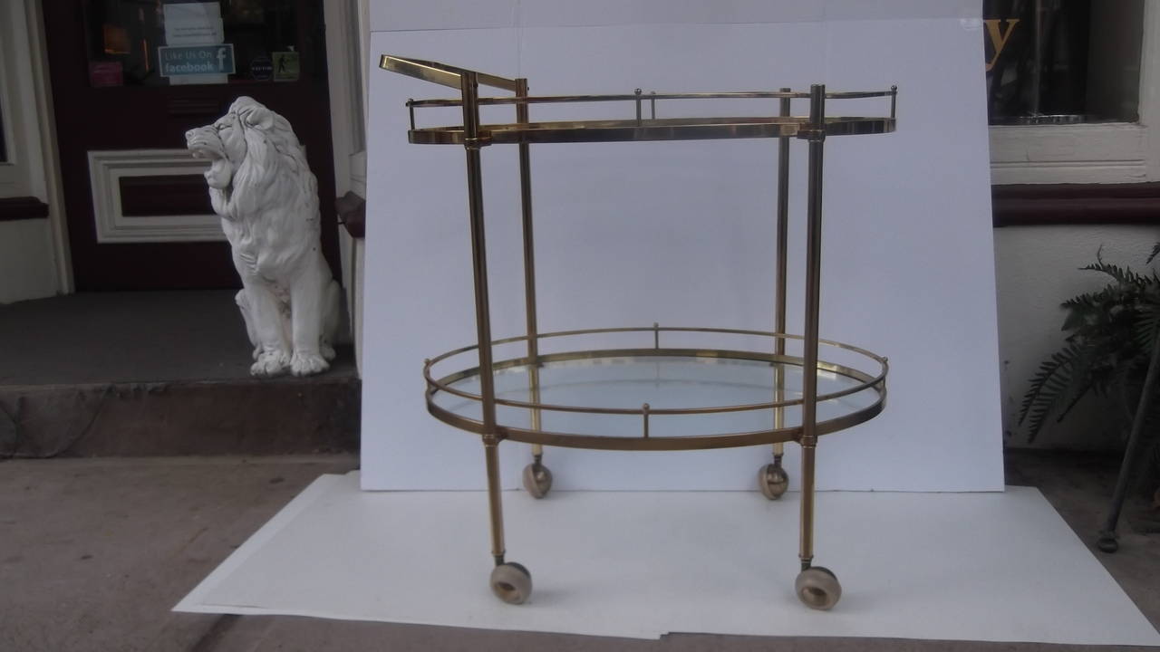 A classic for oval tea or beverage cart, with gallery edge.
Two generous tiers all resting on four castors with a removable handle that you can attach from either side.  An entertaining solution for perfect hosts.