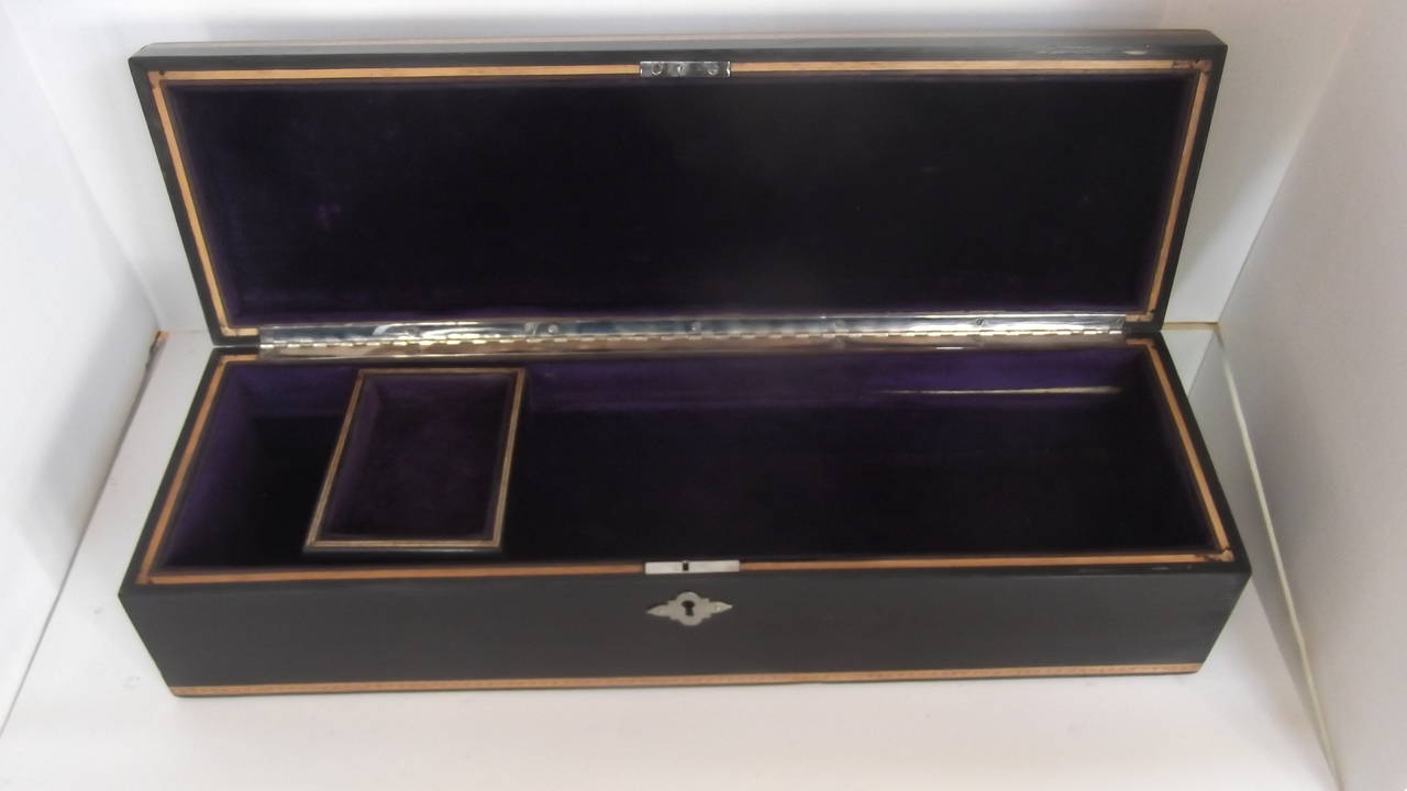 Exceptional inlaid box with recent French polish. The background wood is ebony with inlaid decoration of satinwood and tulip wood.  This box is over 130 years old and in excellent condition. 
Inlaid floral design with initial R
Beautiful inlay