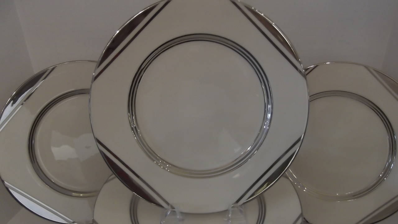 A very glamorous set of 18 period Art Deco platinum decorated service plates.
Early Lenox Green Mark, with a year code of 1933.  These were custom order plates retailed by Ovington Brothers, 5th Avenue, New York city.  Elegant geometric design and