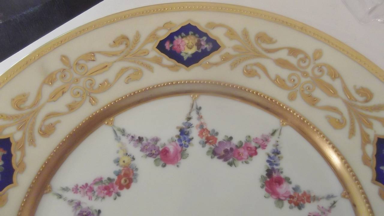 Edwardian A set of 12 Hand Painted Accent Plates with raised gilding.