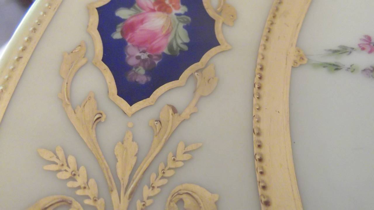 Gilt A set of 12 Hand Painted Accent Plates with raised gilding.
