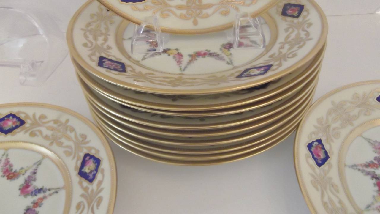 A set of 12 Hand Painted Accent Plates with raised gilding. In Excellent Condition In Lambertville, NJ