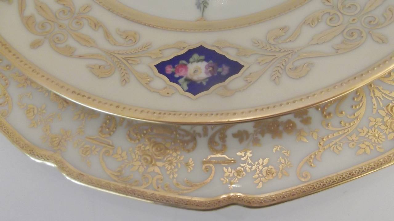 A set of 12 Hand Painted Accent Plates with raised gilding. 1