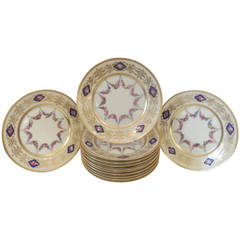 A set of 12 Hand Painted Accent Plates with raised gilding.