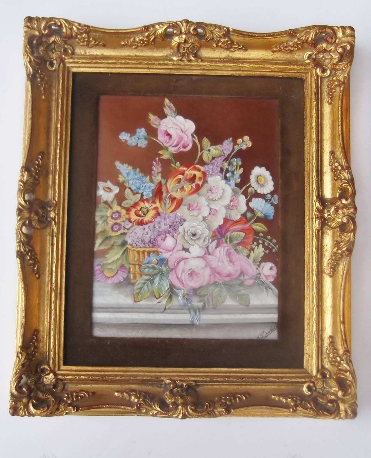 A pair of hand-painted porcelain floral plaques. Artist signed by the notable Limoges painter 