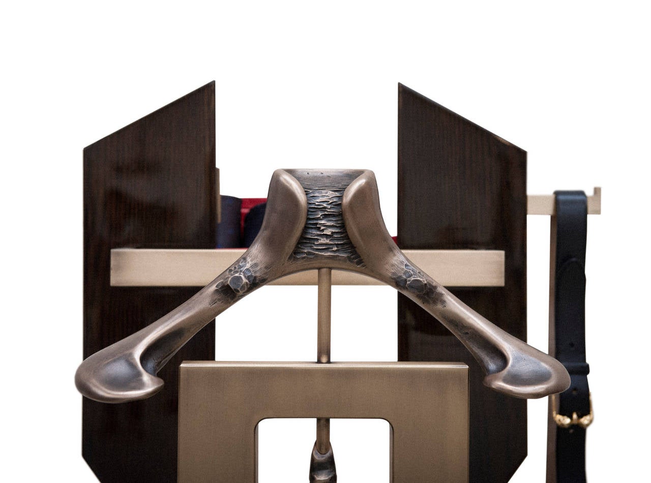 A sculptural bronze men's valet, designed in collaboration with luxury fashion designer Alexander McQueen. Designed as part of the WALLPAPER* Handmade Edition. Features include built in USB charging point, solid bronze shoe horn, hanging rail and