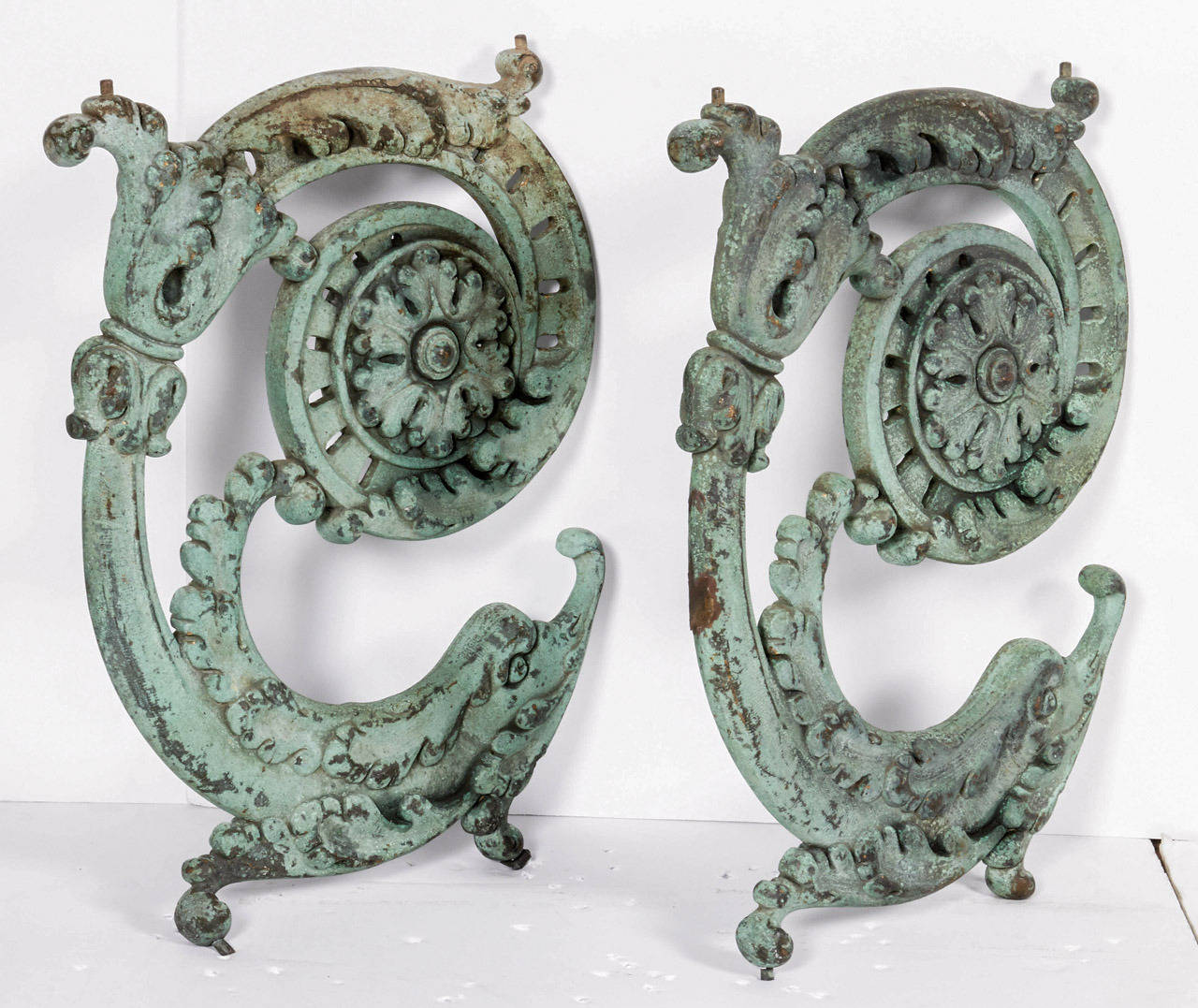 Nicely patinated pair of circa 1900 Beaux Arts style Bronze C scroll balustrade sections having nicely modeled mythological dolphin figures and ornate foliate metalwork with rosette motifs.