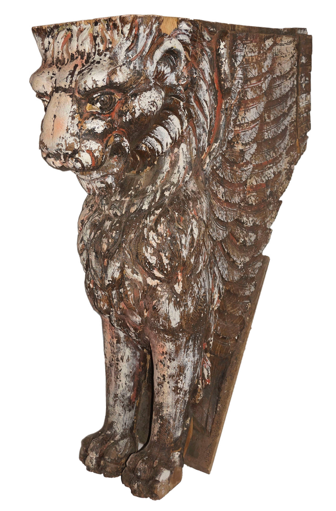 Circa 1895 carved wood winged lion ornament of impressive scale. Exceptional craftsmanship is shown in the detailed feathers of the wings and the rendering of the lion's face and mane.  Provenance: Originally formed part of the newel post of the
