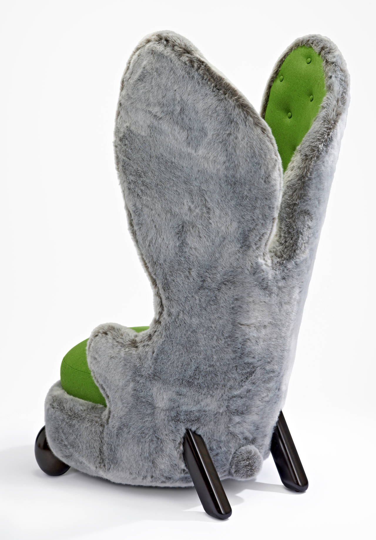 Armchair in wool and faux fur, the legs are in varnished wood.
Edition of 99.
Signed and numbered.

Three different faux fur available (grey, white, brown) and a large palette of colors for the seat.

Hubert le Gall was born in Lyon in 1961.