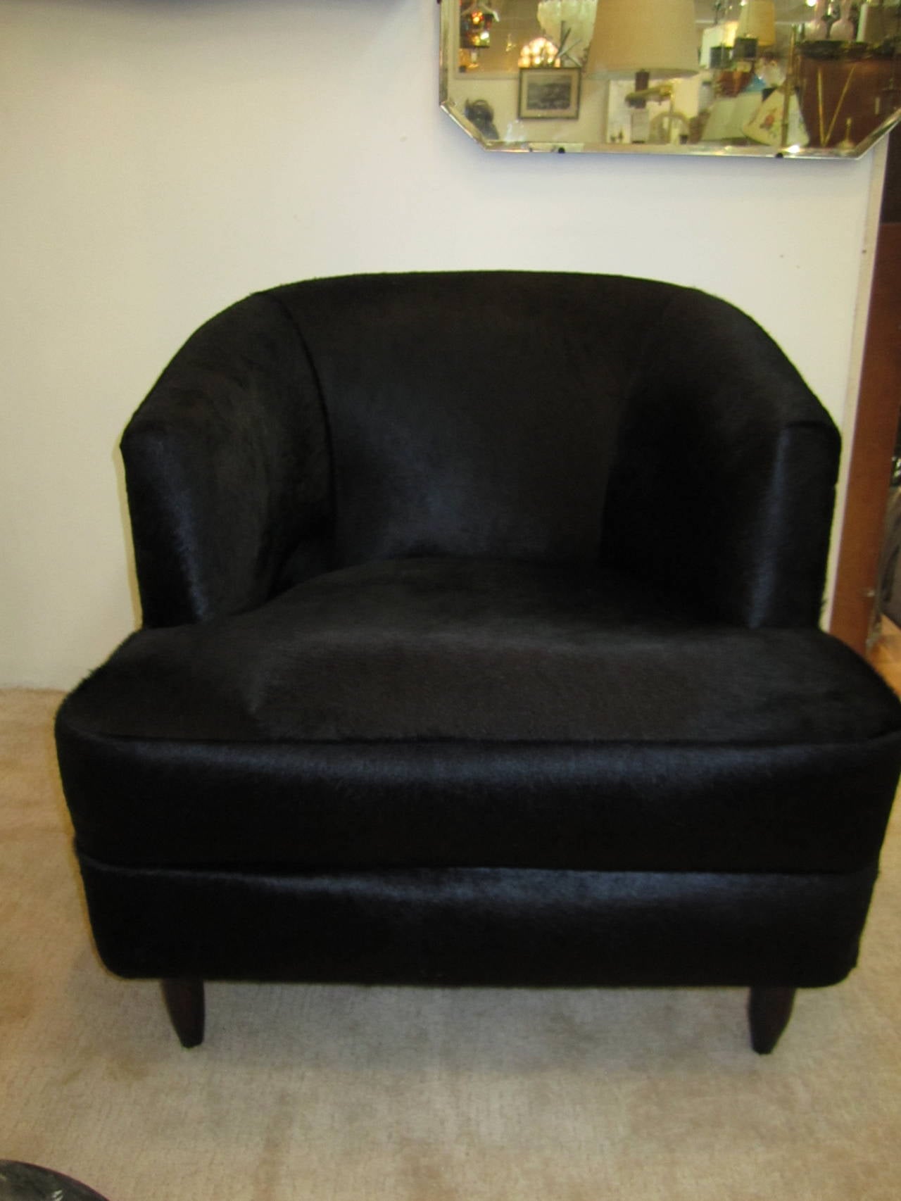 Stunning custom upholstered club or corner chair in black hide. Entire chair is upholstered in authentic black hide. Very luxurious, gorgeous. Item available here online. By request, item can be made available by appointment to the Trade (in New
