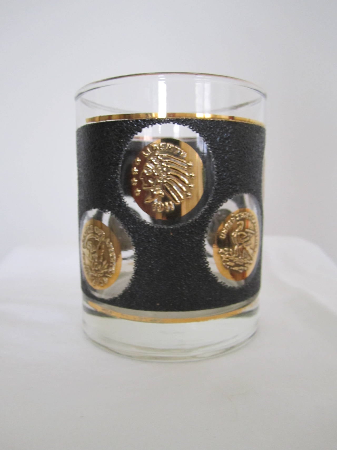 12 vintage Mid-Century Modern "Roly Poly" rocks glasses with black and gold coin motif. Set available here online. By request, set can be made available by appointment to the Trade in New York.

I
  