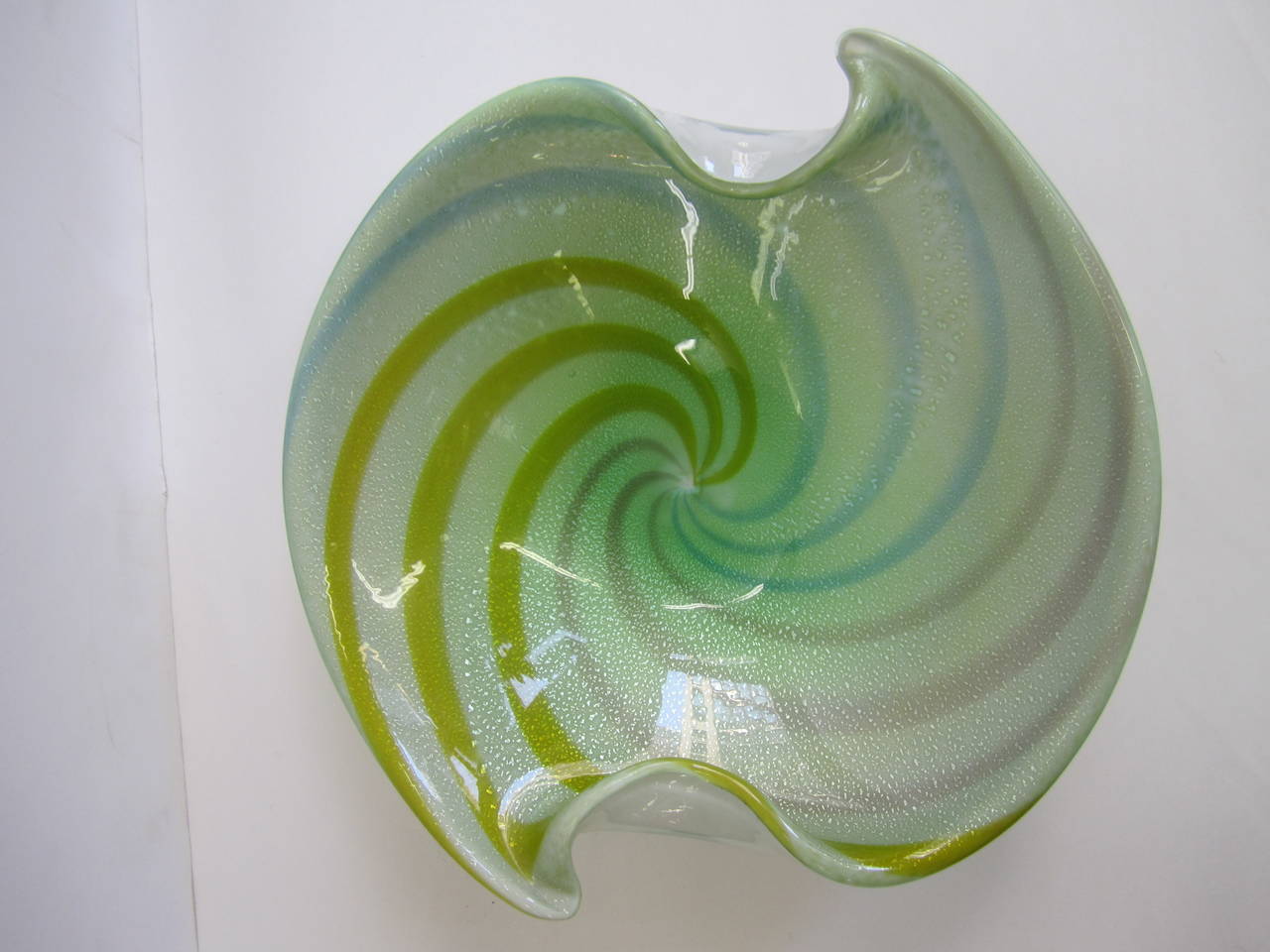 A vintage Mid-Century Italian Murano multicolored art glass bowl with shades of yellow, pink, green and blue with silver flecks throughout. 

Item available here online. By request, item can be made available by appointment to the Trade in New