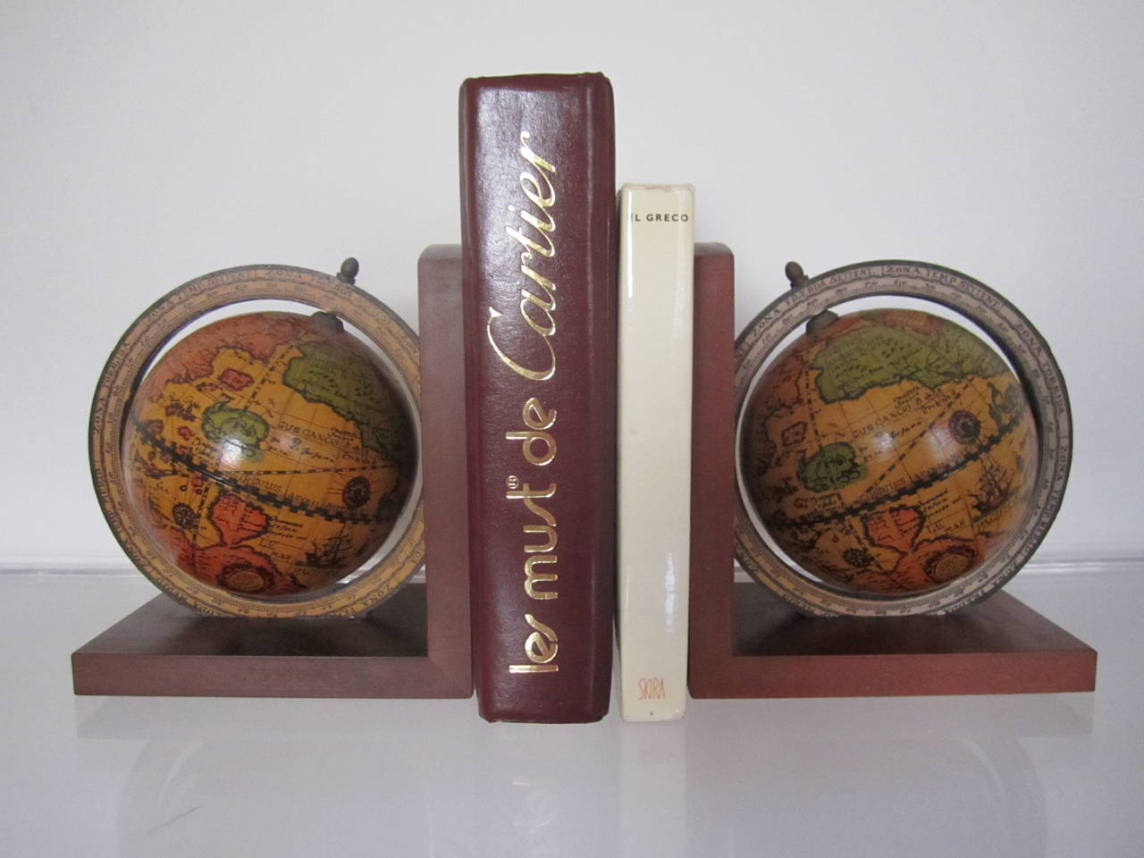 A very cool pair of vintage globe bookends, made in Italy, that spin.