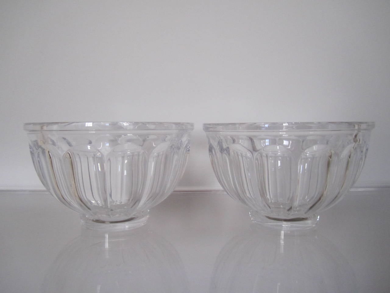 A beautiful and substantial pair of vintage Scandinavian crystal bowls by Orrefors. Both signed and numbered on bottom. Pair available here online. By request, pair can be made available by appointment to the Trade (in New York.)
 