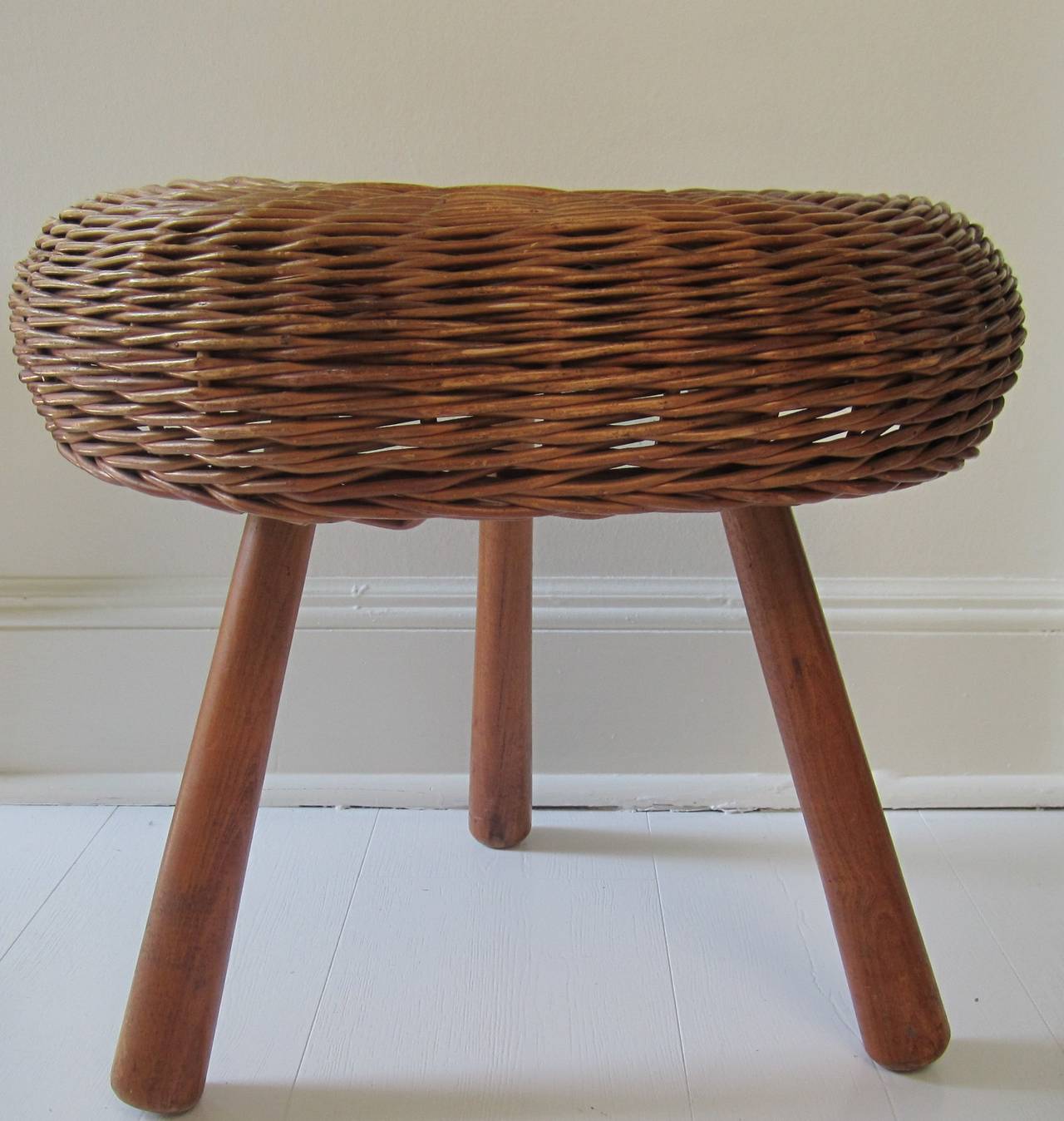 A vintage Mid-Century European wicker 'tri-pod' stool or low side table. Marked underneath, 'made in Yugoslavia' as show in image #6. Piece can be used as a side table providing there is a tray for stability (as show in image #7 and #9.)

Piece